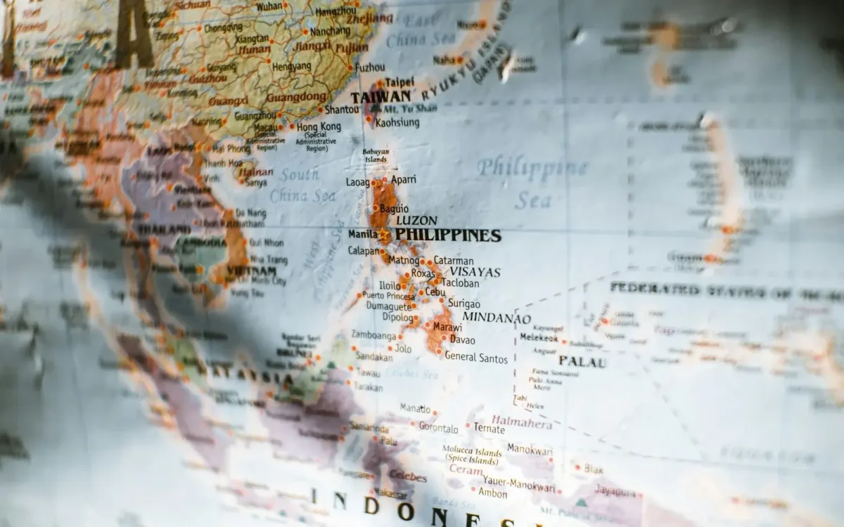 Close-up of a printed map of the Philippines — Luzon, Visayas, and Mindanao, the nationwide footprint DA5 partner outlets cover